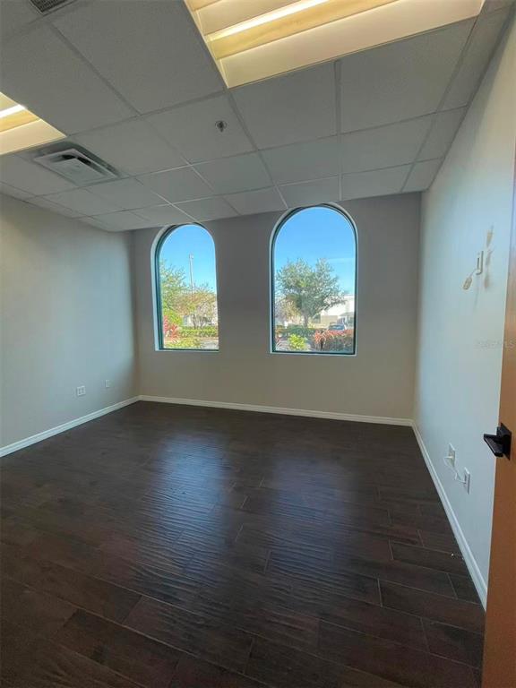 7075 Kingspointe Parkway, Unit 9 Orlando, FL 32819 - Photo 44 of 49 an empty room with windows