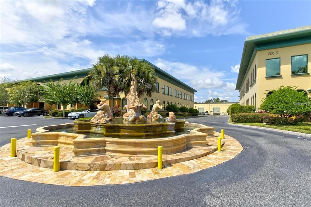 7075 Kingspointe Parkway, Unit 9 Orlando, FL 32819 - Photo 49 of 49 a view of a swimming pool with a patio