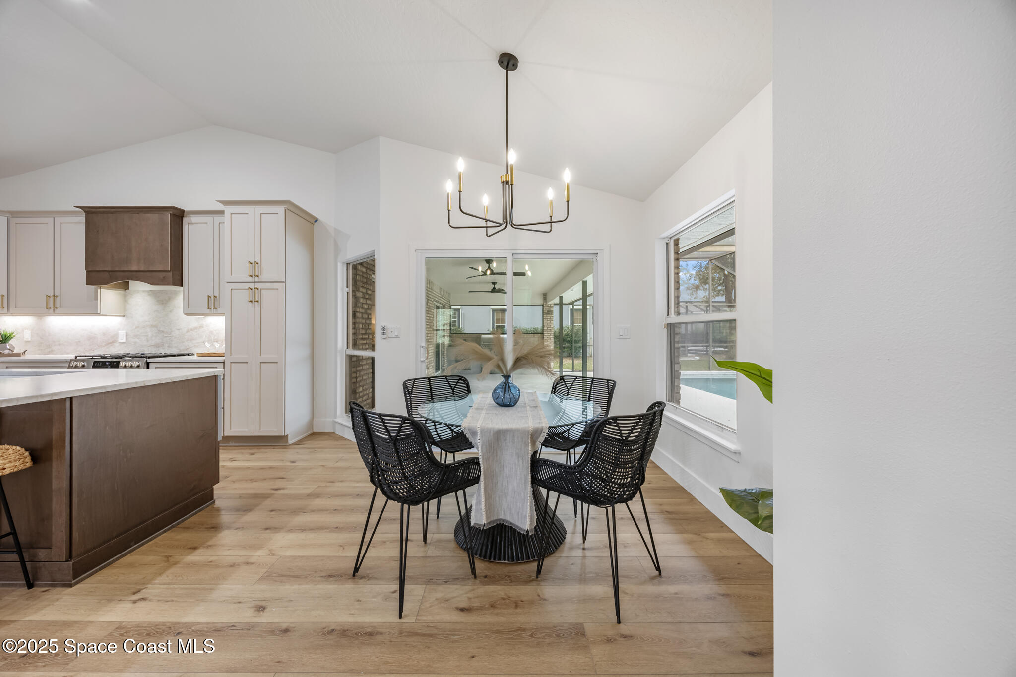 4737 Canard Road Melbourne, FL 32934 - Photo 16 of 35 a view of a dining room with furniture window and wooden floor
