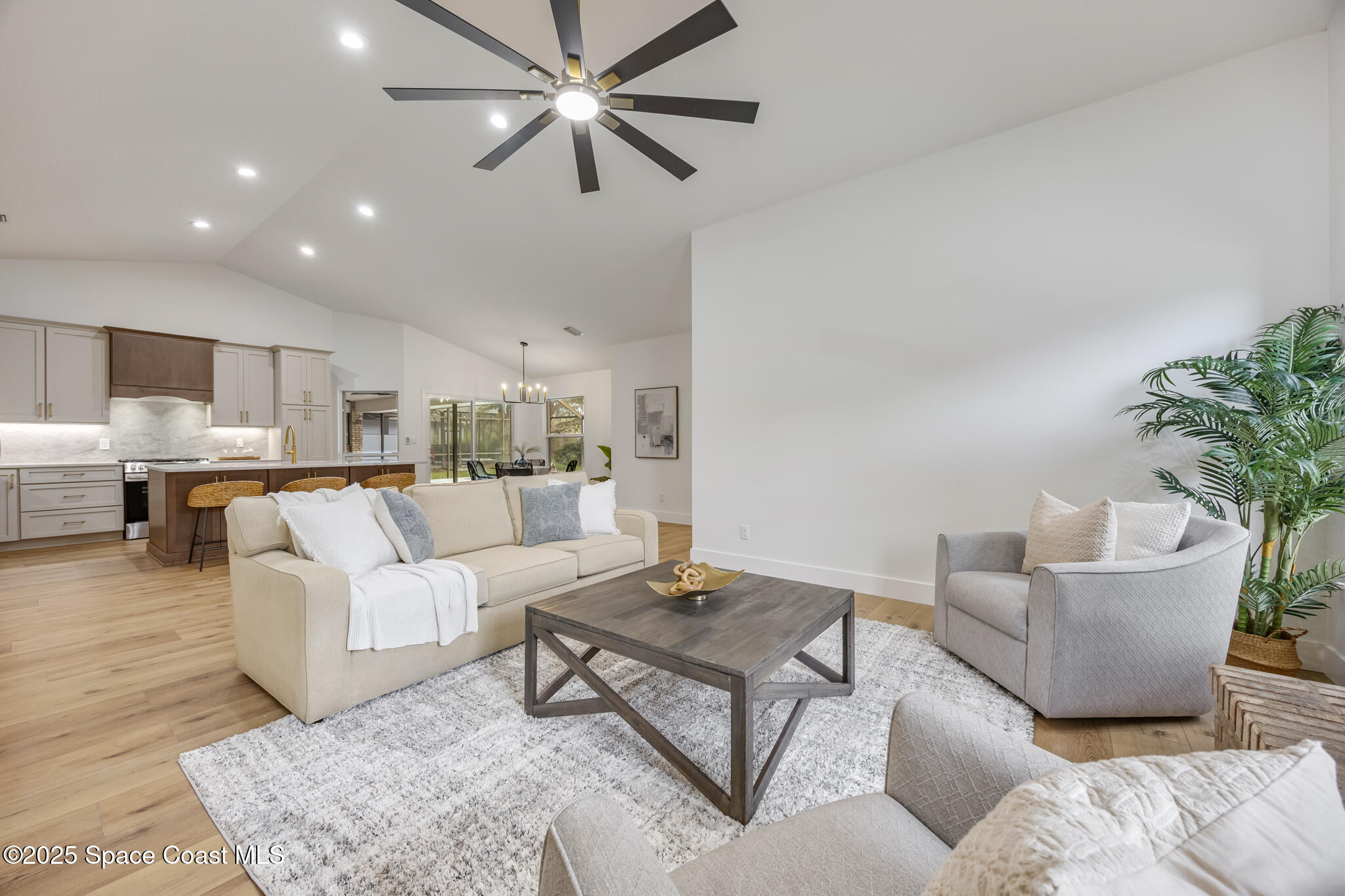 4737 Canard Road Melbourne, FL 32934 - Photo 18 of 35 a living room with furniture and a view of kitchen