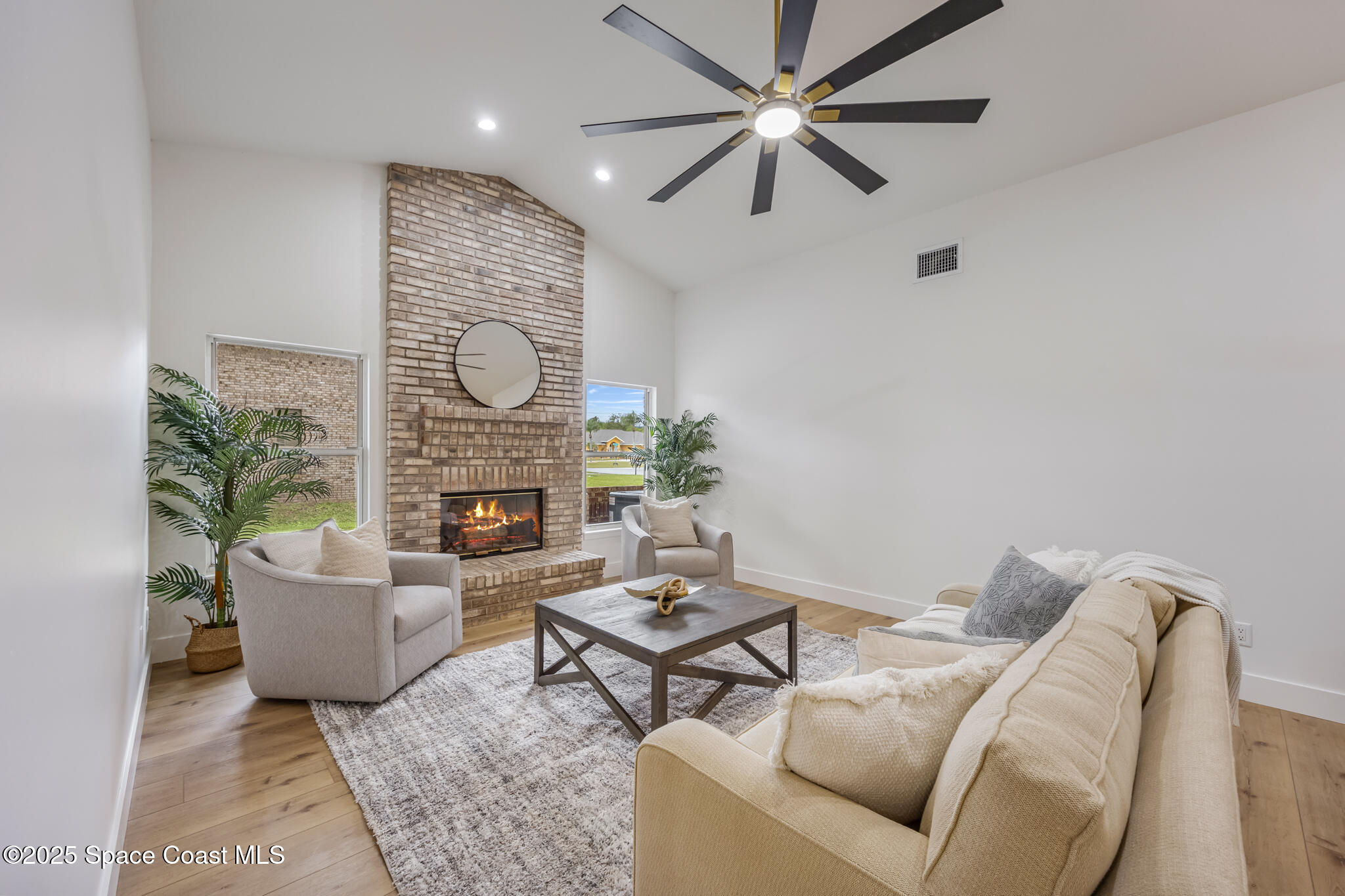 4737 Canard Road Melbourne, FL 32934 - Photo 20 of 35 a living room with furniture and a fireplace