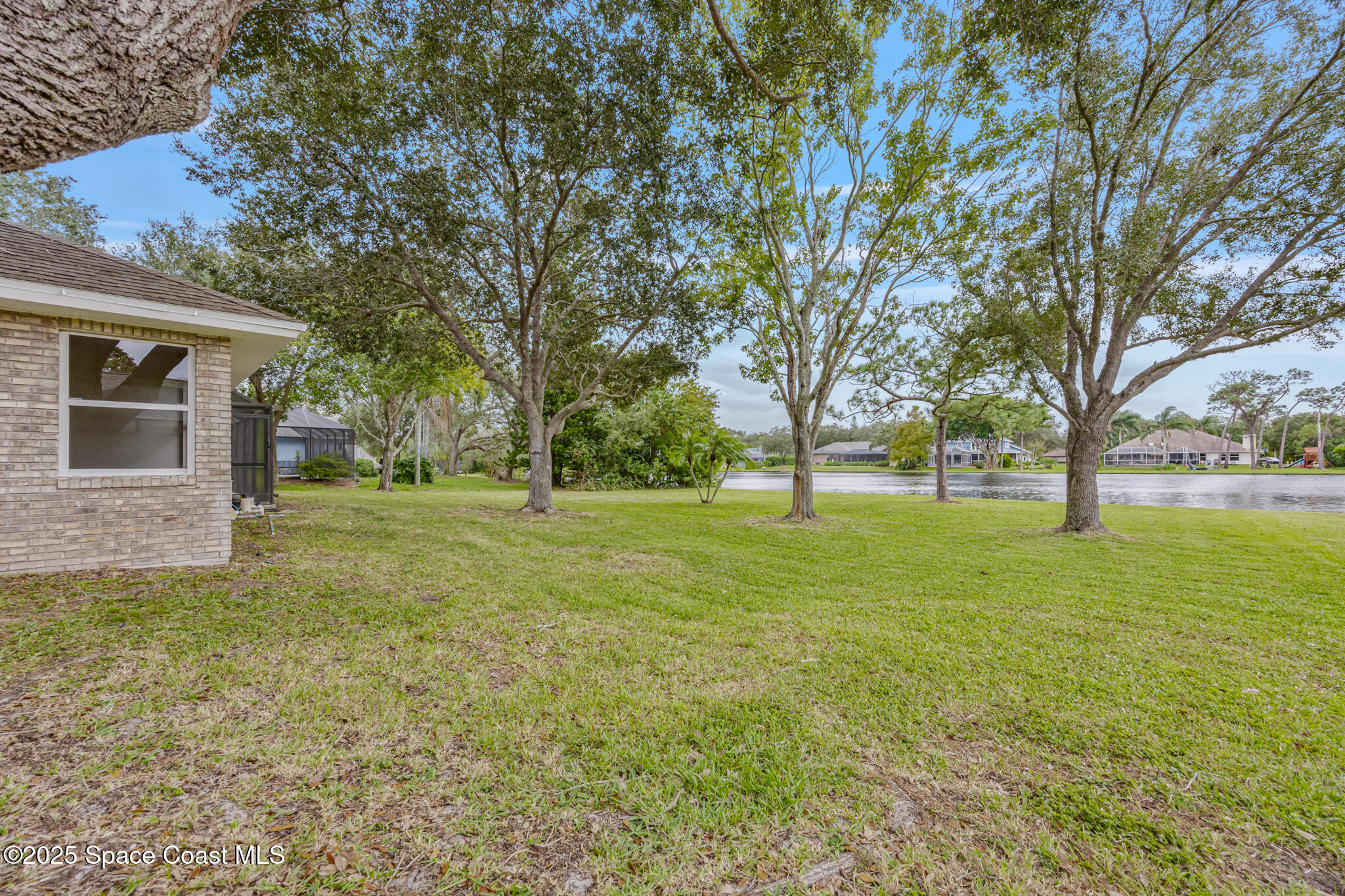 4737 Canard Road Melbourne, FL 32934 - Photo 30 of 35 a view of outdoor space with deck and garden