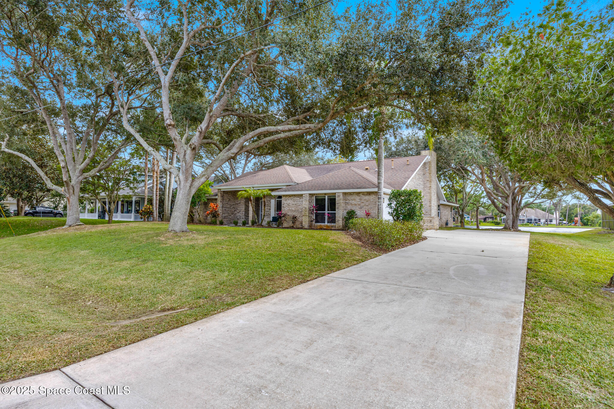 4737 Canard Road Melbourne, FL 32934 - Photo 3 of 35 a front view of house with yard and green space