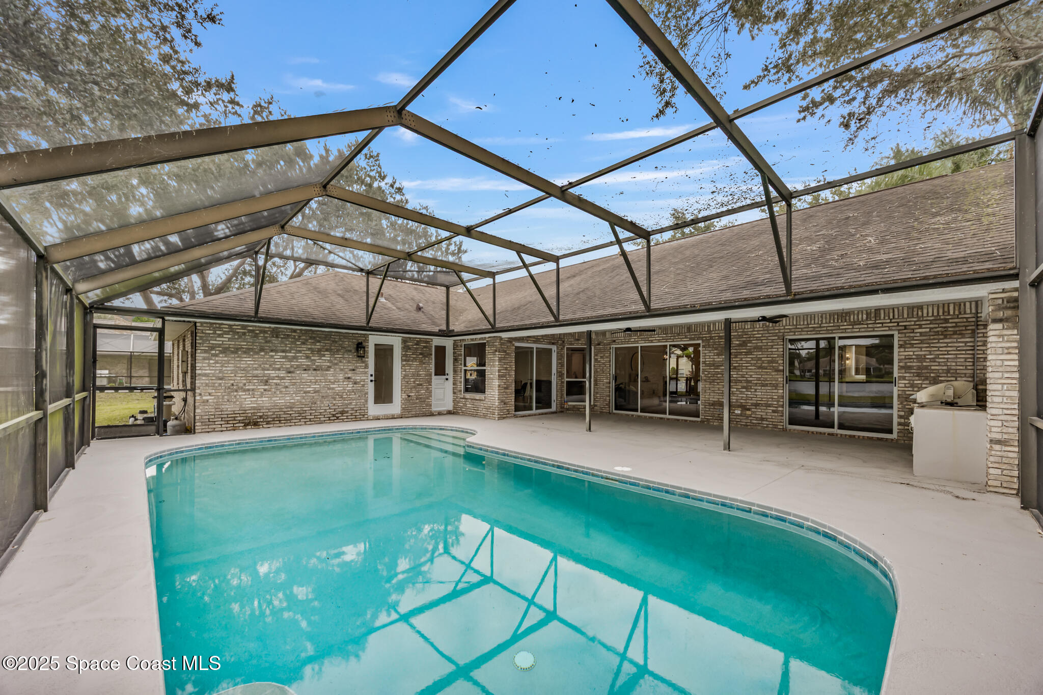 4737 Canard Road Melbourne, FL 32934 - Photo 31 of 35 a view of a swimming pool with a patio