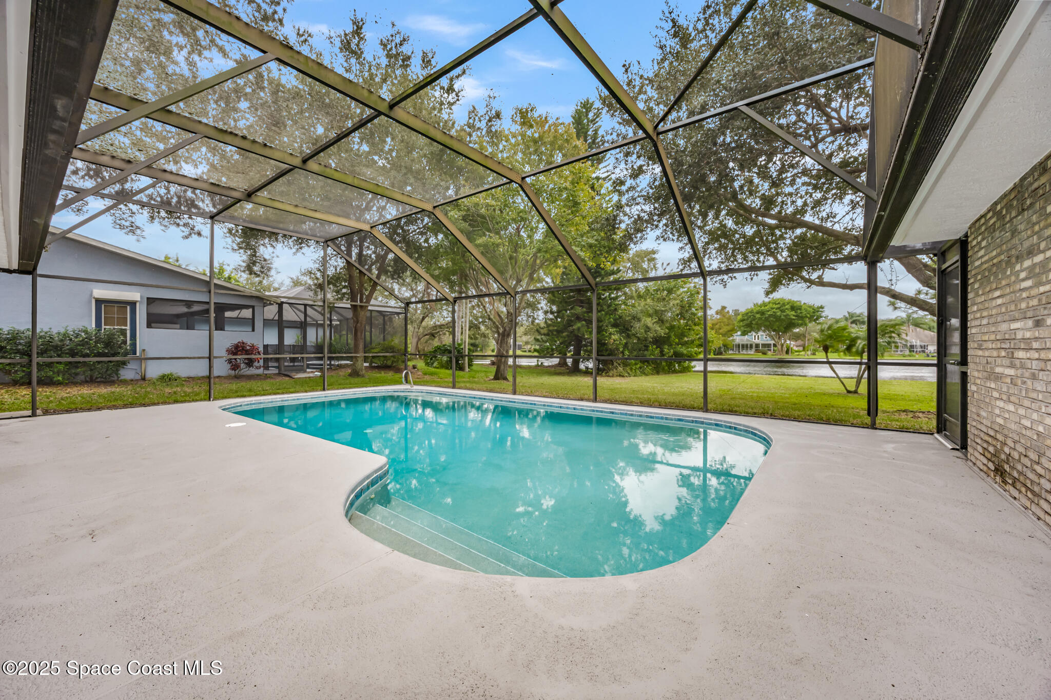 4737 Canard Road Melbourne, FL 32934 - Photo 33 of 35 a view of a swimming pool with a yard