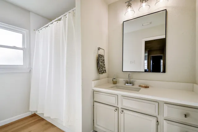 a bathroom with a sink and a mirror