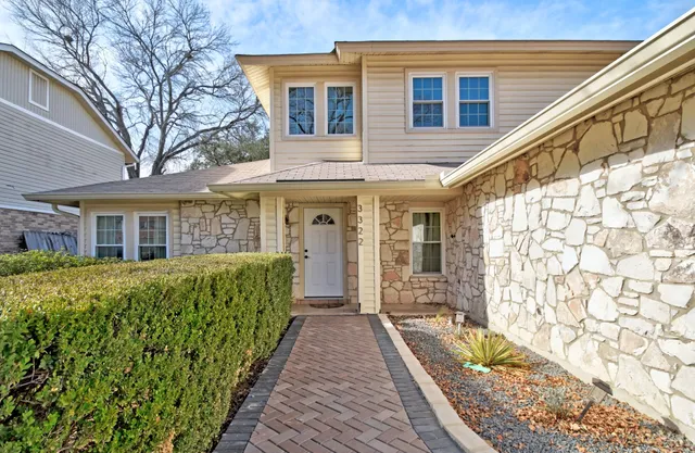 a front view of a house with a large window
