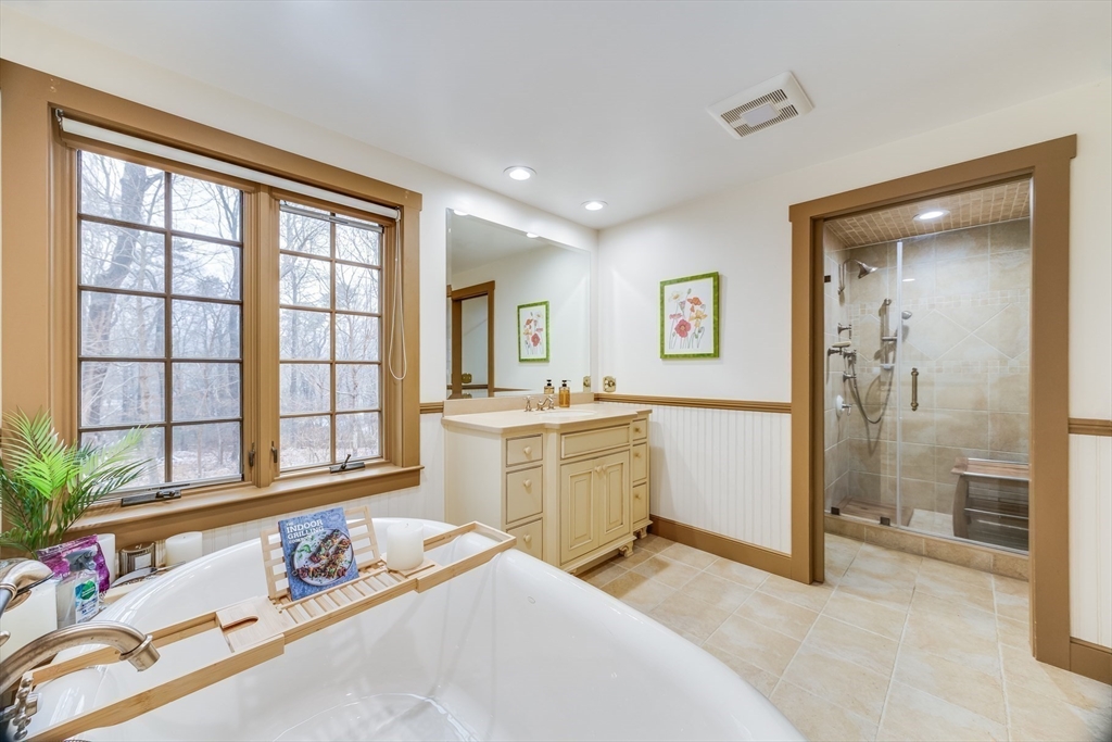 3 Popes Meadows Sandwich, MA 02563 - Photo 18 of 41 a spacious bathroom with a tub sink and mirror