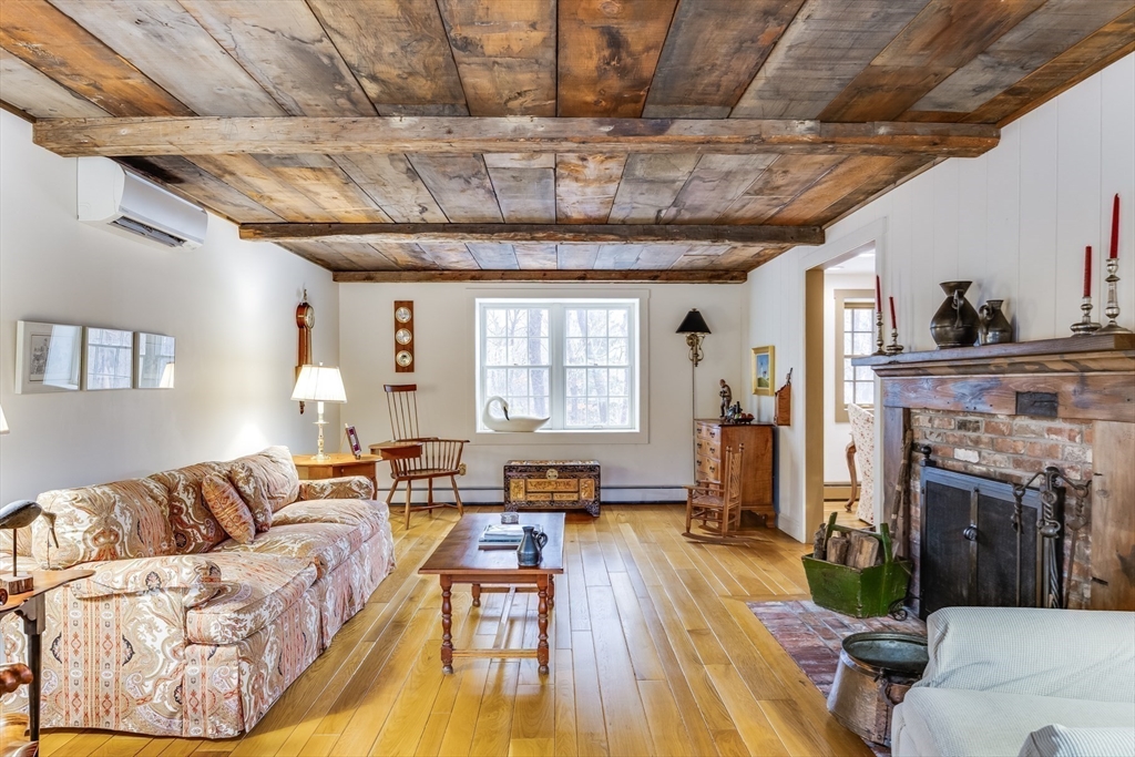 3 Popes Meadows Sandwich, MA 02563 - Photo 4 of 41 a living room with furniture and a fireplace