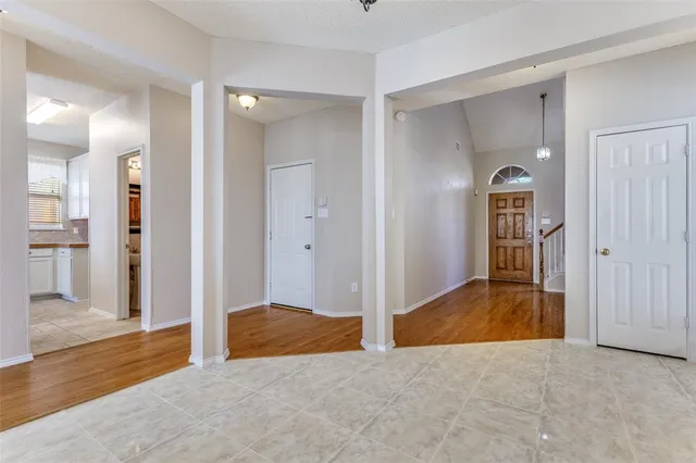 a view of a bedroom with cabinet and windows