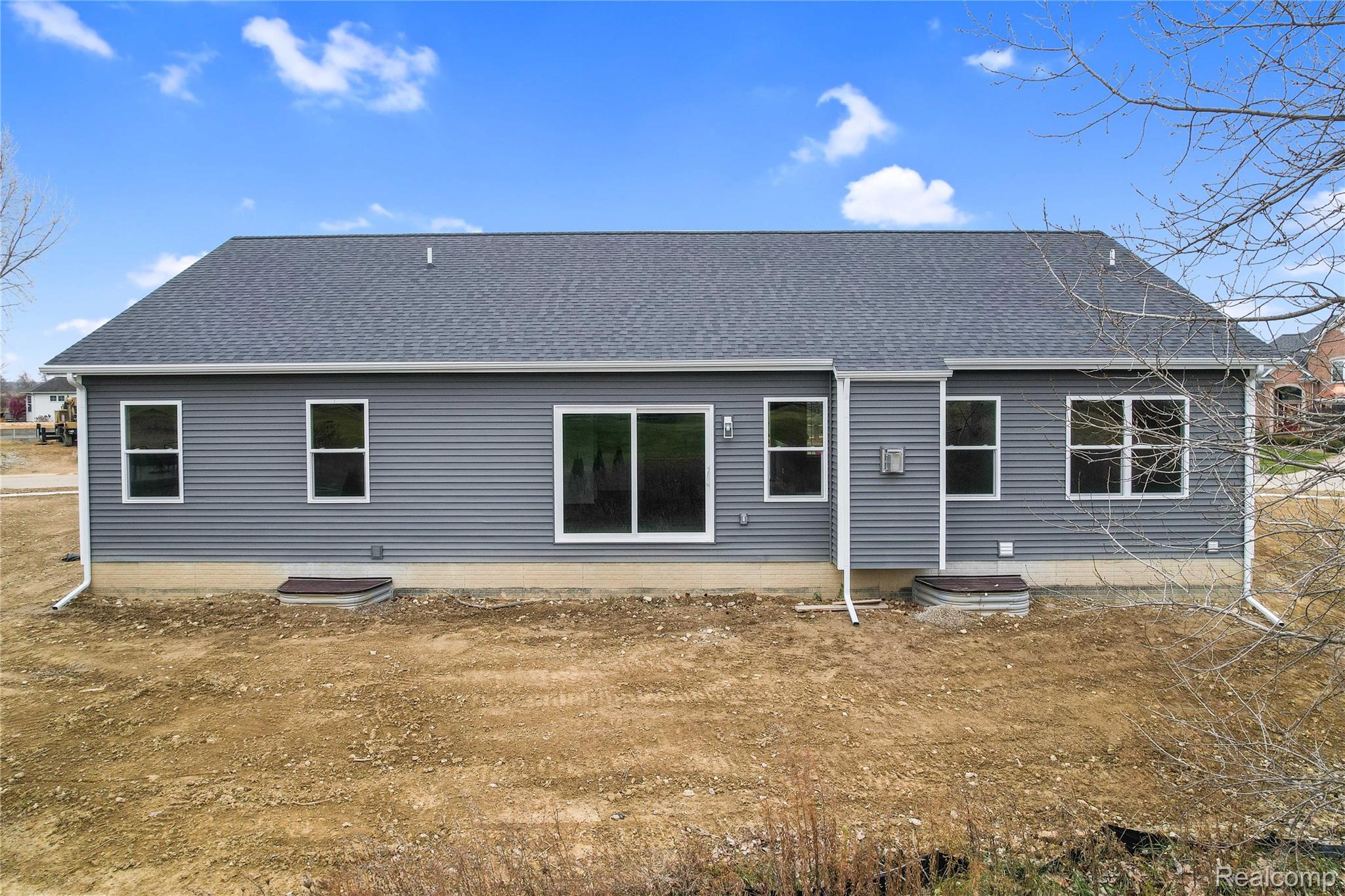 9033 Copper Ridge Drive Davison, MI 48423 - Photo 27 of 29 Rear view of property with a shingled roof