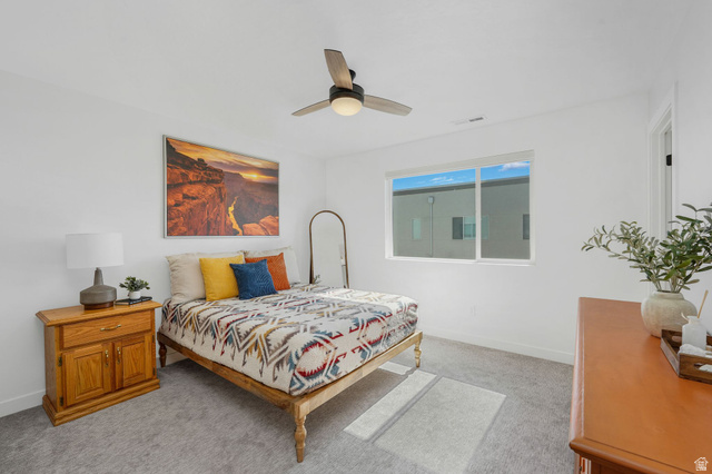493 East Alice Way Layton, UT 84041 - Photo 13 of 31 Bedroom with light colored carpet and ceiling fan