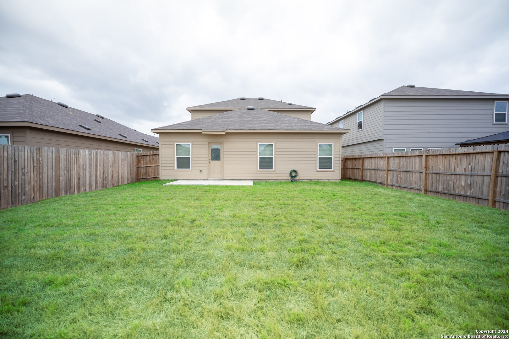 3431 Andromeda Way Converse, TX 78109 - Photo 22 of 24 a view of a house with a yard and a garden