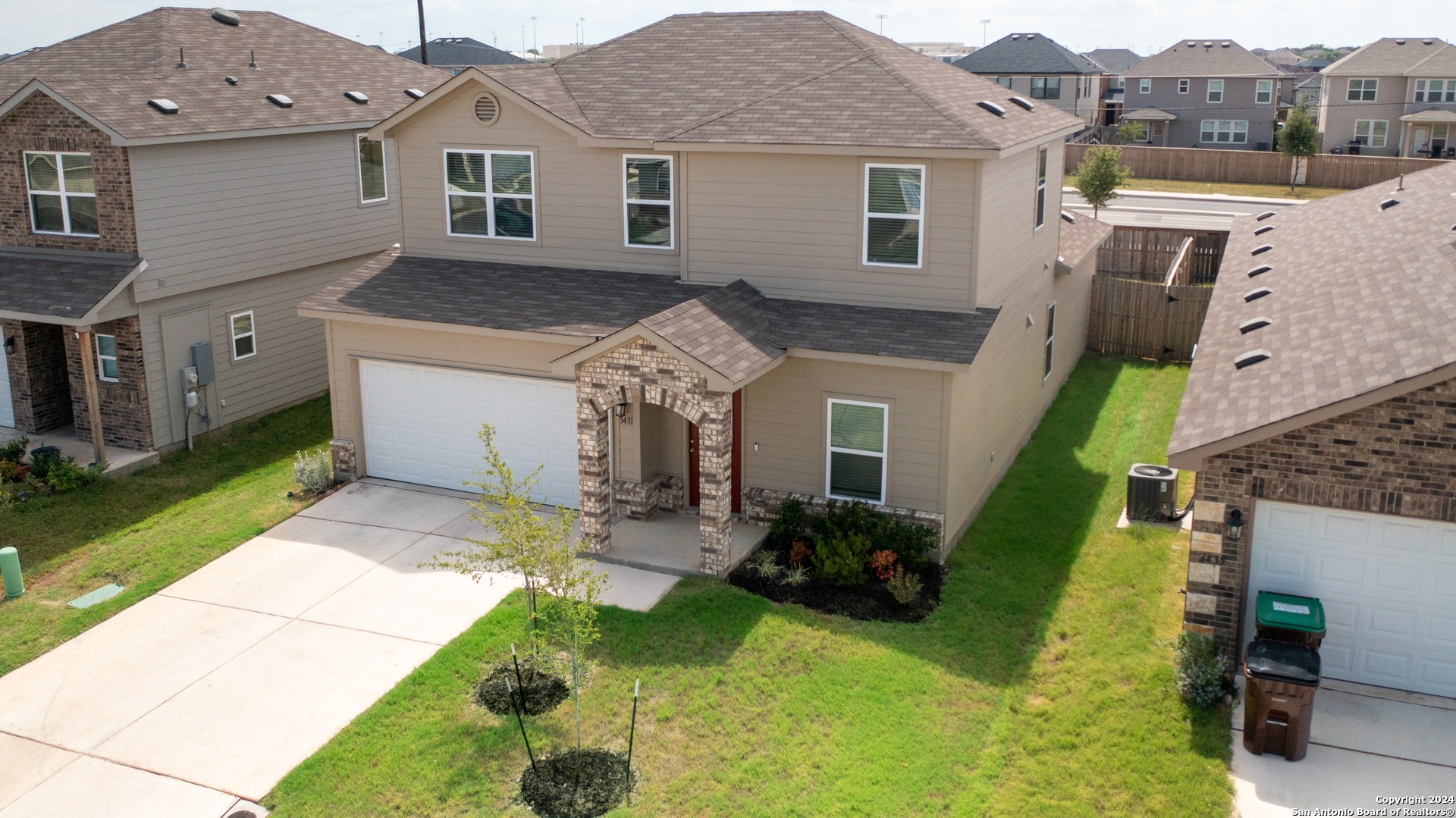 3431 Andromeda Way Converse, TX 78109 - Photo 24 of 24 a view of a house with backyard and a tree