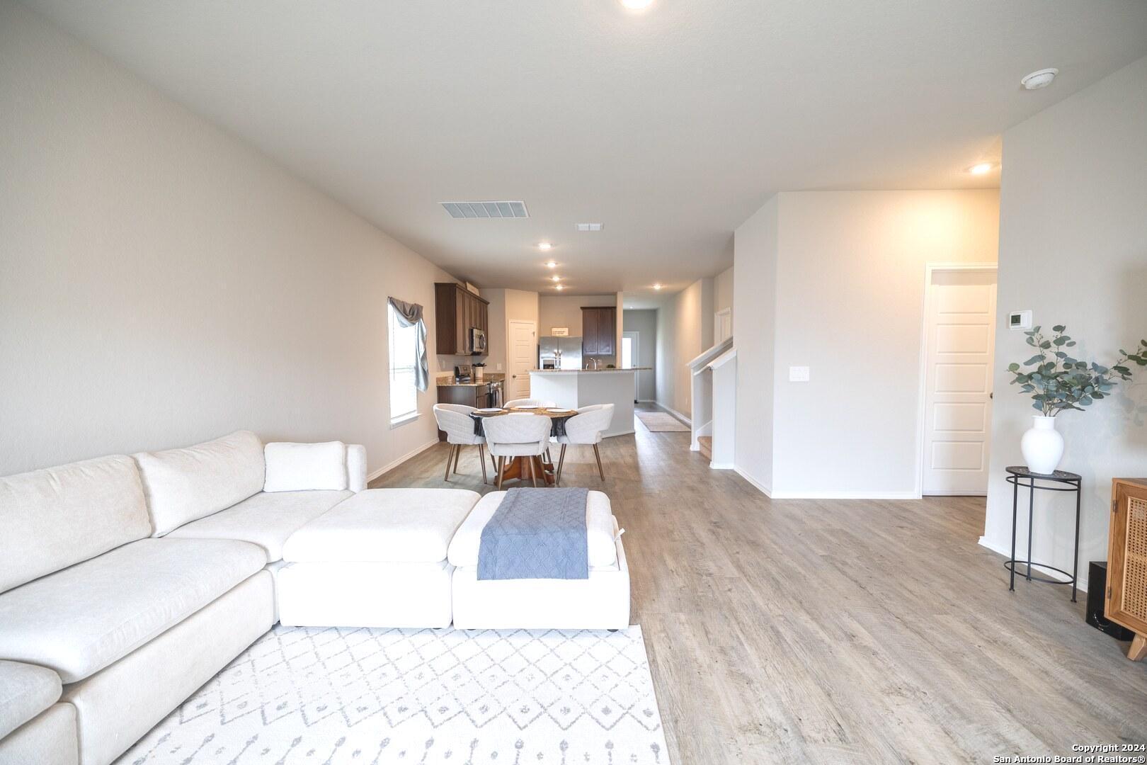3431 Andromeda Way Converse, TX 78109 - Photo 4 of 24 a living room with furniture and a wooden floor