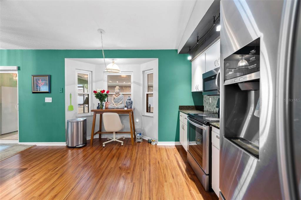 11244 Redgate Street Spring Hill, FL 34609 - Photo 12 of 50 a view of a living room with furniture and a flat screen tv