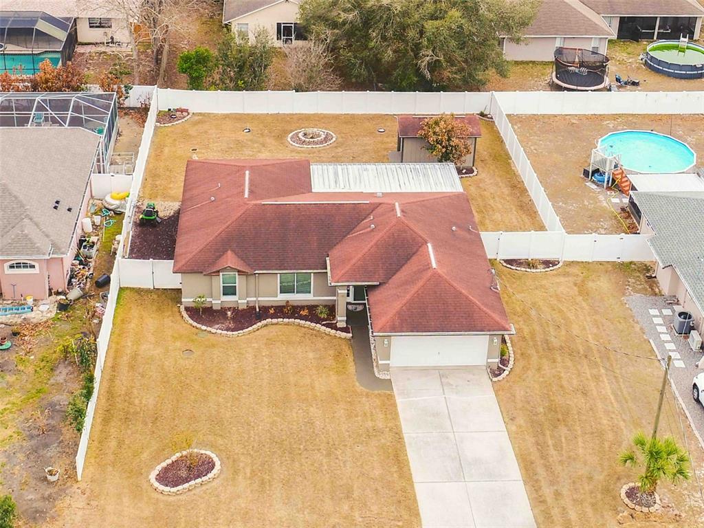 11244 Redgate Street Spring Hill, FL 34609 - Photo 2 of 50 an aerial view of a house with swimming pool
