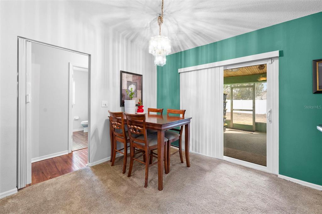 11244 Redgate Street Spring Hill, FL 34609 - Photo 21 of 50 a dining room with furniture and window
