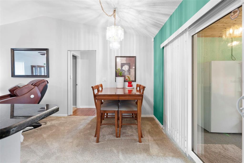 11244 Redgate Street Spring Hill, FL 34609 - Photo 23 of 50 a dining room with furniture and window