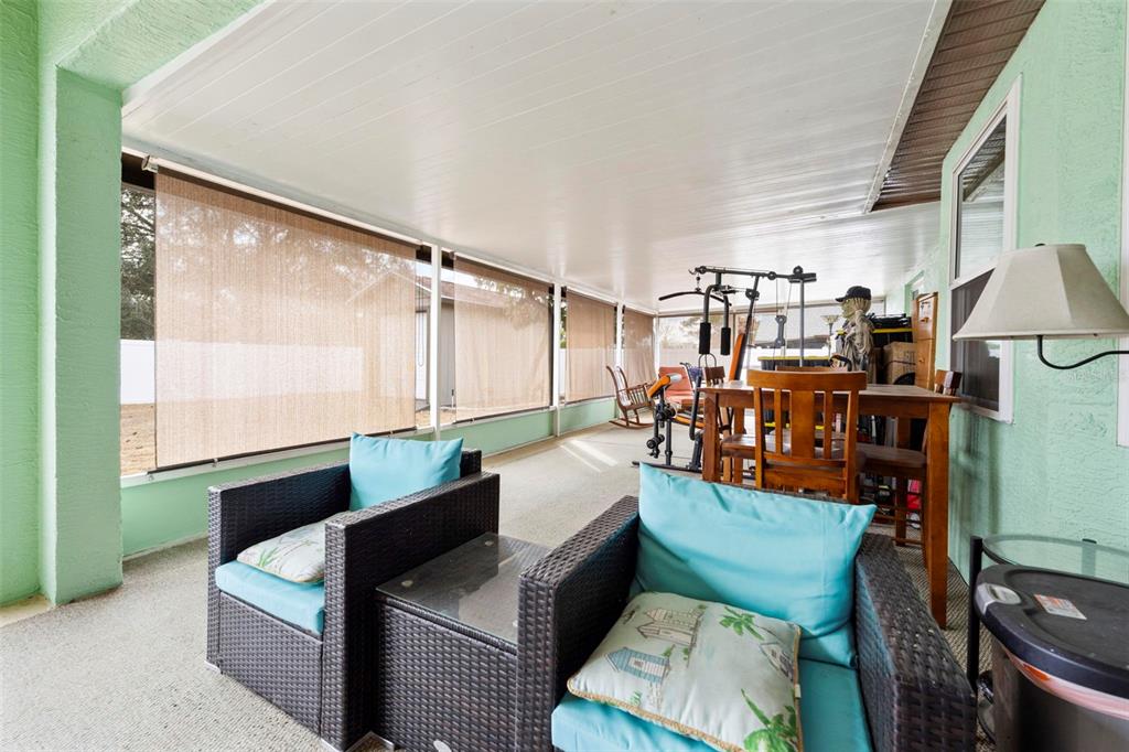 11244 Redgate Street Spring Hill, FL 34609 - Photo 25 of 50 a living room with furniture and a window