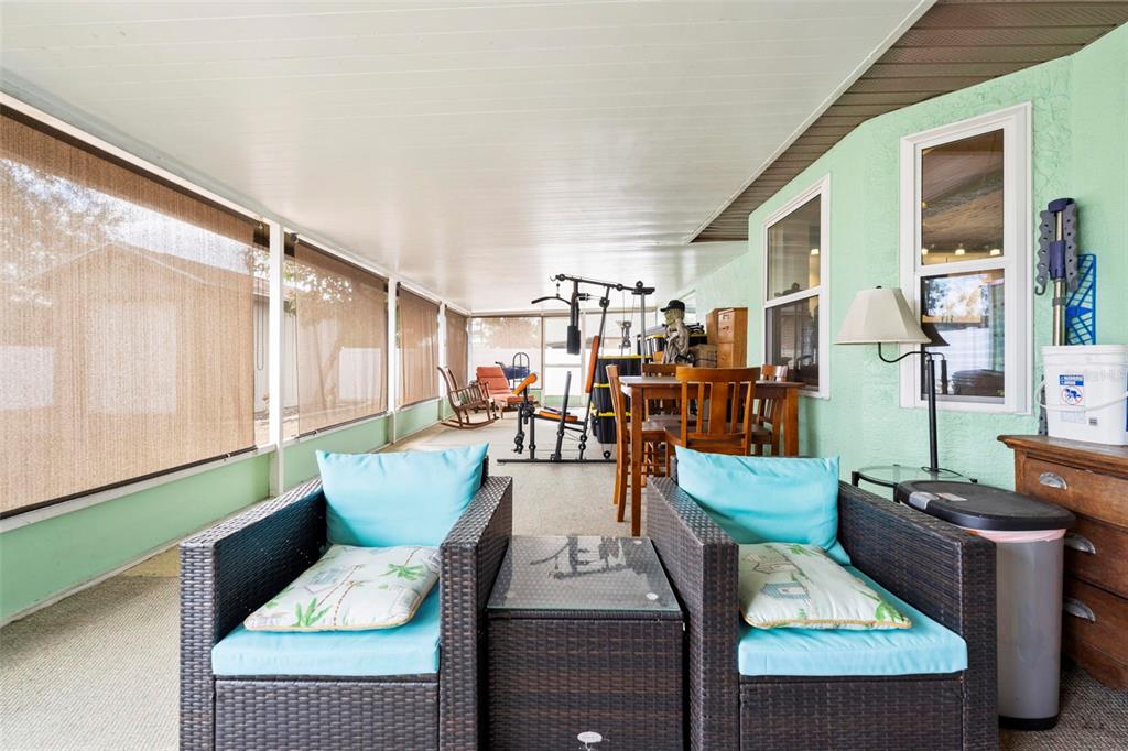 11244 Redgate Street Spring Hill, FL 34609 - Photo 26 of 50 a living room with furniture and wooden floor