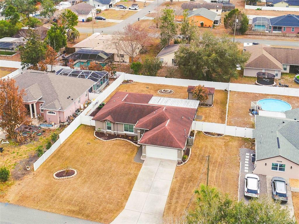 11244 Redgate Street Spring Hill, FL 34609 - Photo 27 of 50 an aerial view of a house with pool