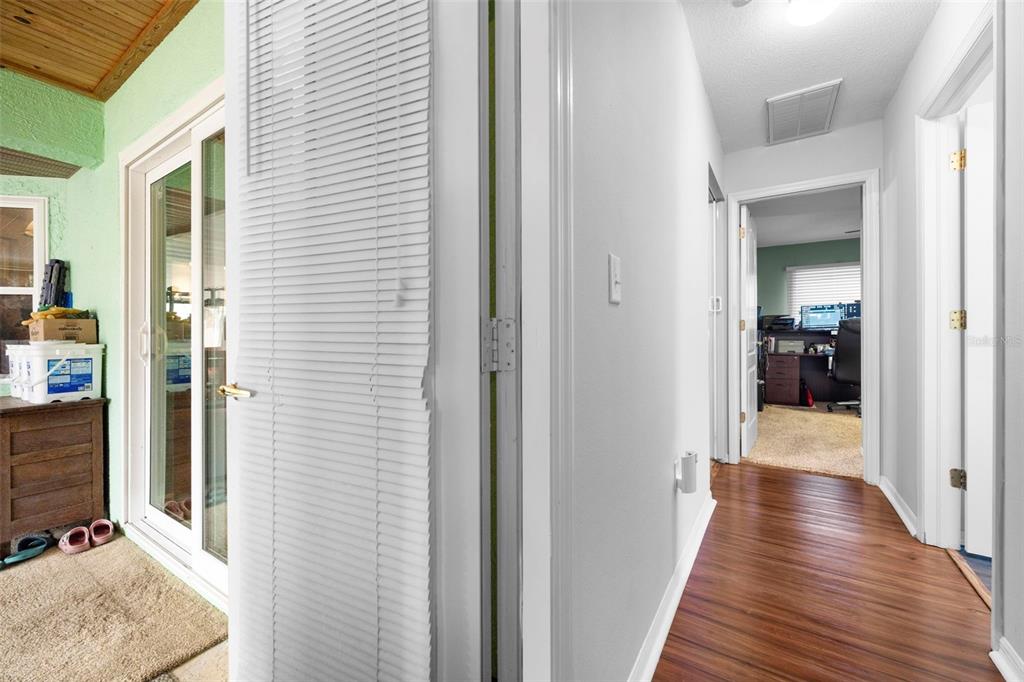 11244 Redgate Street Spring Hill, FL 34609 - Photo 31 of 50 a view of a hallway with wooden floor