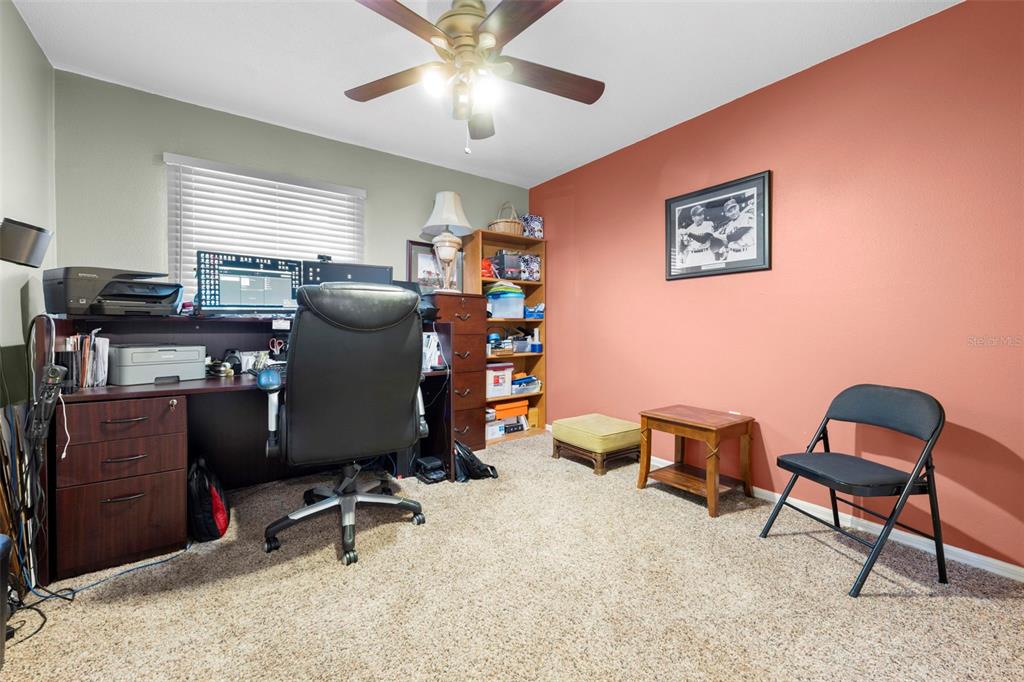 11244 Redgate Street Spring Hill, FL 34609 - Photo 34 of 50 a view of a workspace with furniture and a window