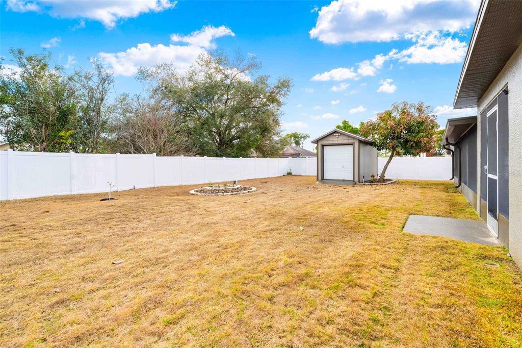 11244 Redgate Street Spring Hill, FL 34609 - Photo 43 of 50 a view of an outdoor space and swimming pool
