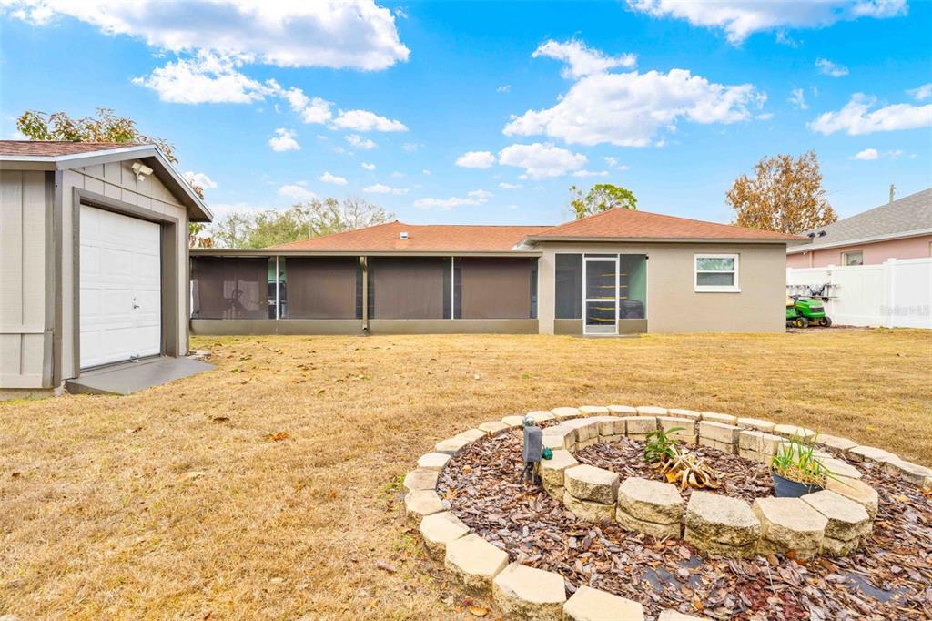 11244 Redgate Street Spring Hill, FL 34609 - Photo 46 of 50 a front view of a house with a yard