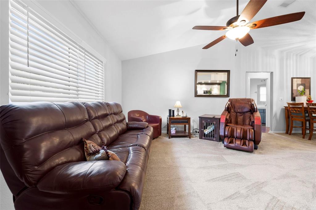 11244 Redgate Street Spring Hill, FL 34609 - Photo 6 of 50 a living room with furniture and a ceiling fan