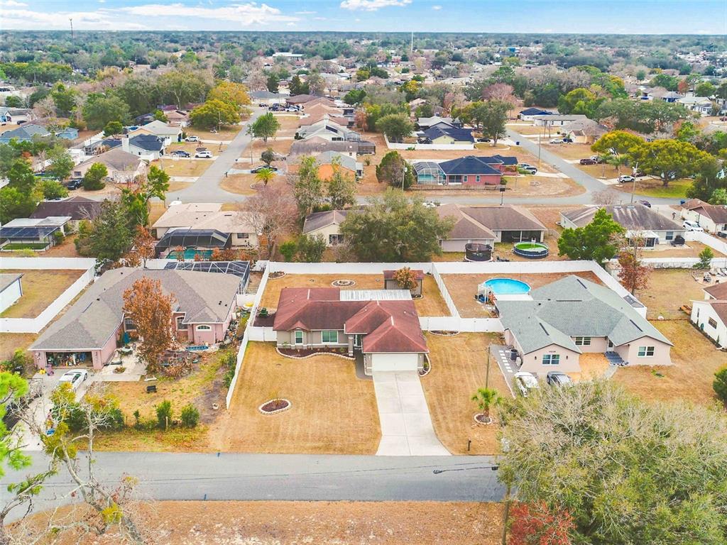 11244 Redgate Street Spring Hill, FL 34609 - Photo 9 of 50 an aerial view of residential houses with outdoor space