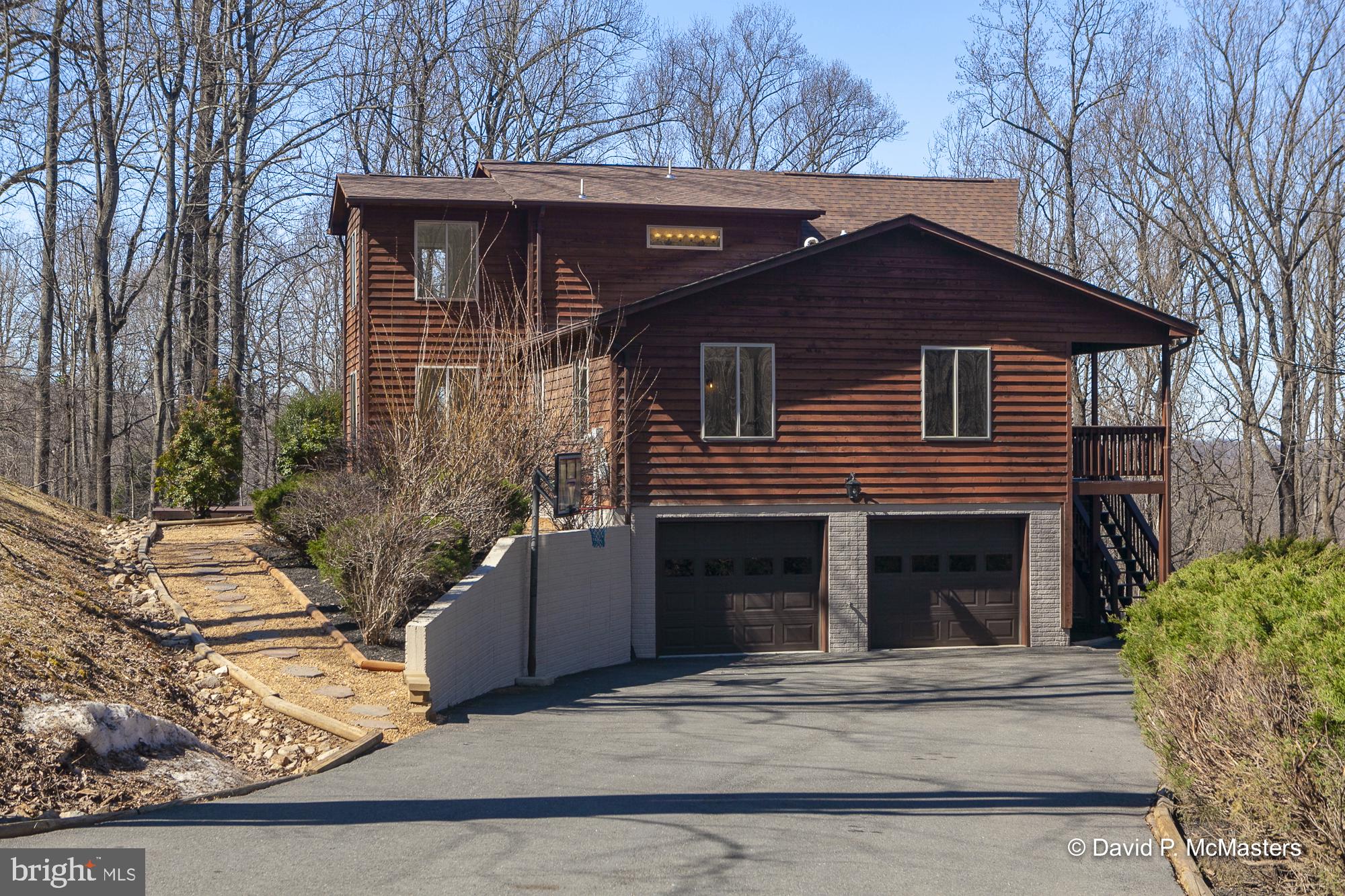 760 High Knob Road Front Royal, VA 22630 - Photo 3 of 63 a front view of a house with a yard