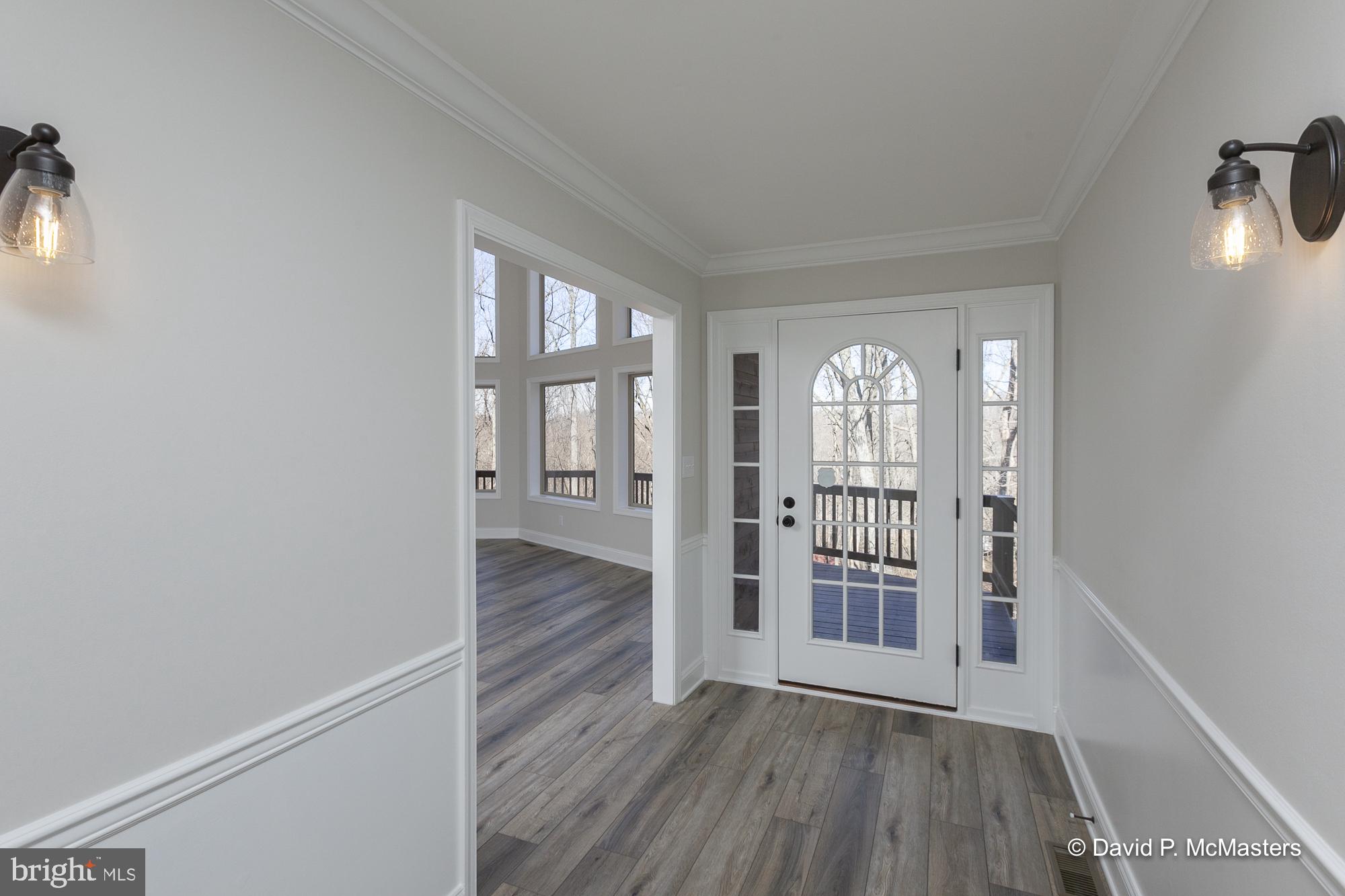 760 High Knob Road Front Royal, VA 22630 - Photo 4 of 63 wooden floor in an empty room with a window