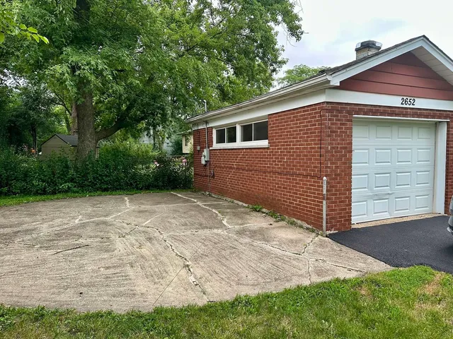 a backyard of a house with lots of green space