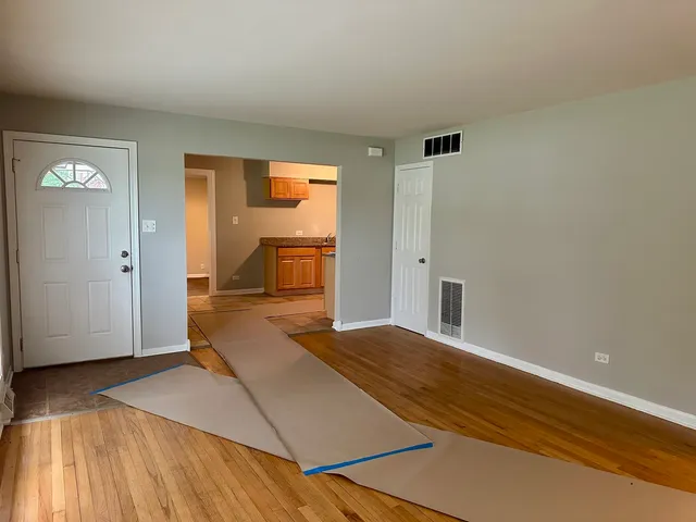 a bedroom with a bed and a table