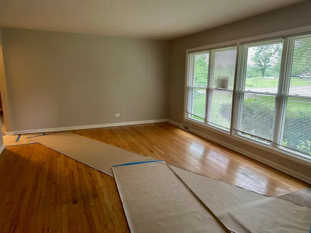a view of empty room with floor to ceiling window