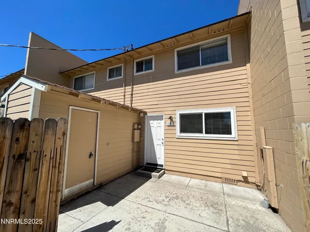 a view of a house with a door and wooden door