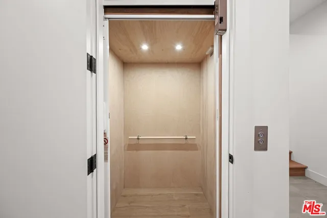 a view of balcony with two potted plants