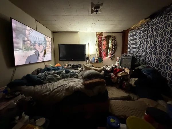 a view of a livingroom with furniture and a flat screen tv