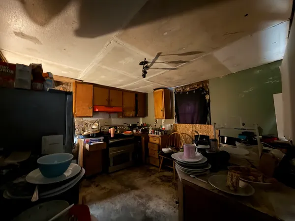 a kitchen with a stove and a refrigerator