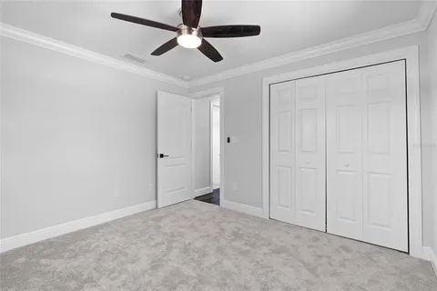 an empty room with fan