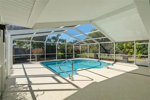 a view of a tennis ground with a large window