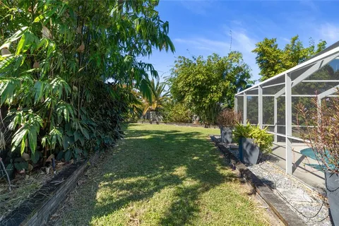 a view of a chair and table on the garden