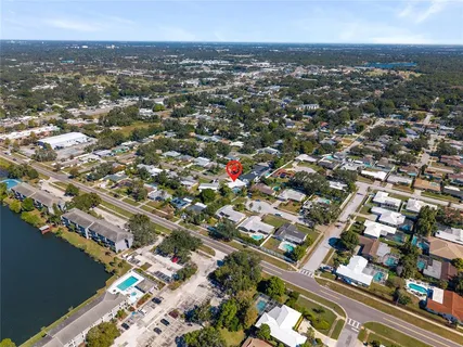 an aerial view of city and lake