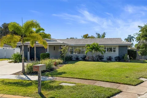 a front view of house with yard and outdoor seating