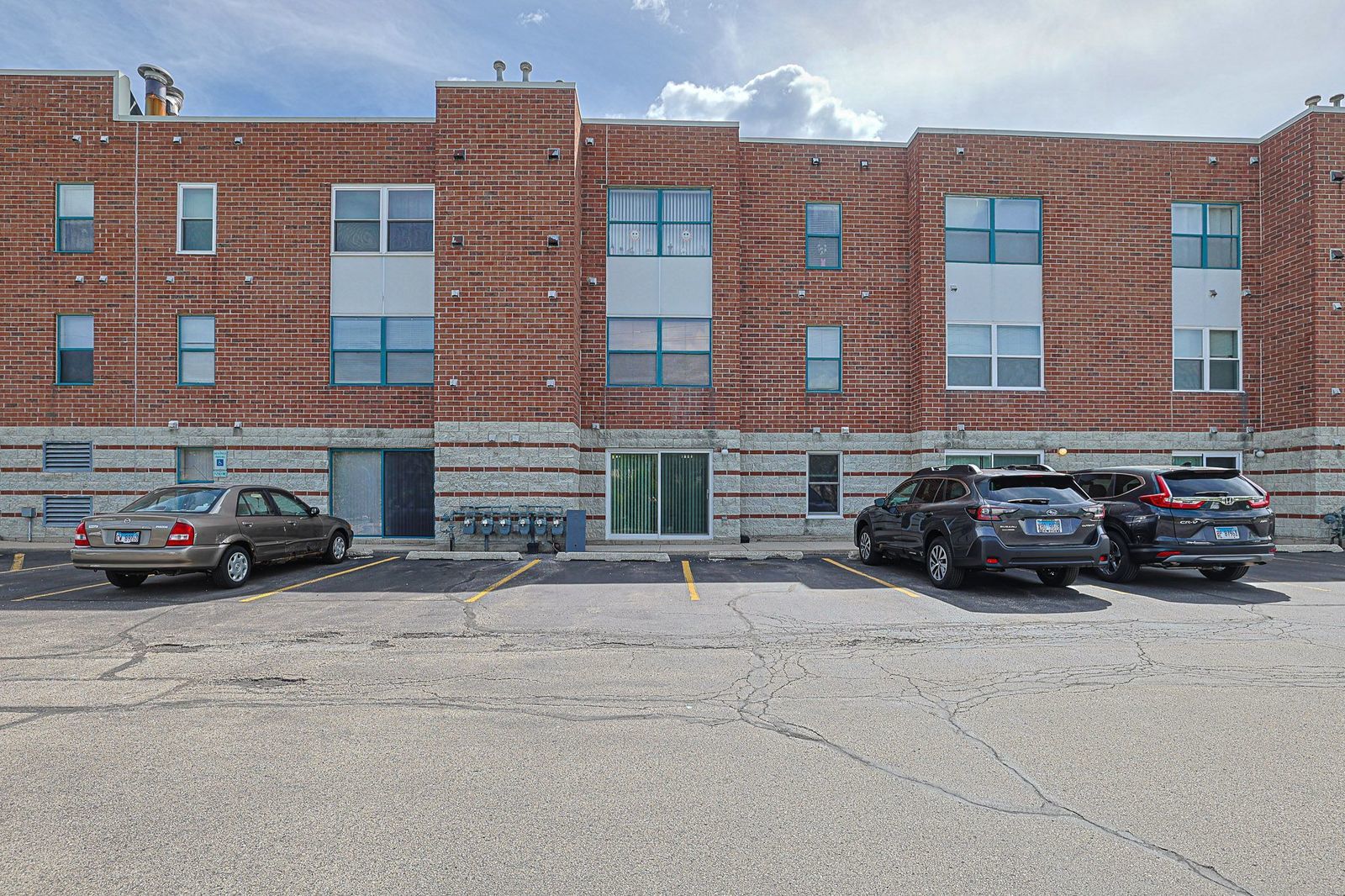 3265 Kirchoff Road, Unit 127 Rolling Meadows, IL 60008 - Photo 2 of 22 a car parked in front of a big building