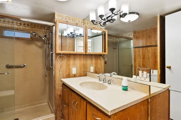 a bathroom with a sink and mirror