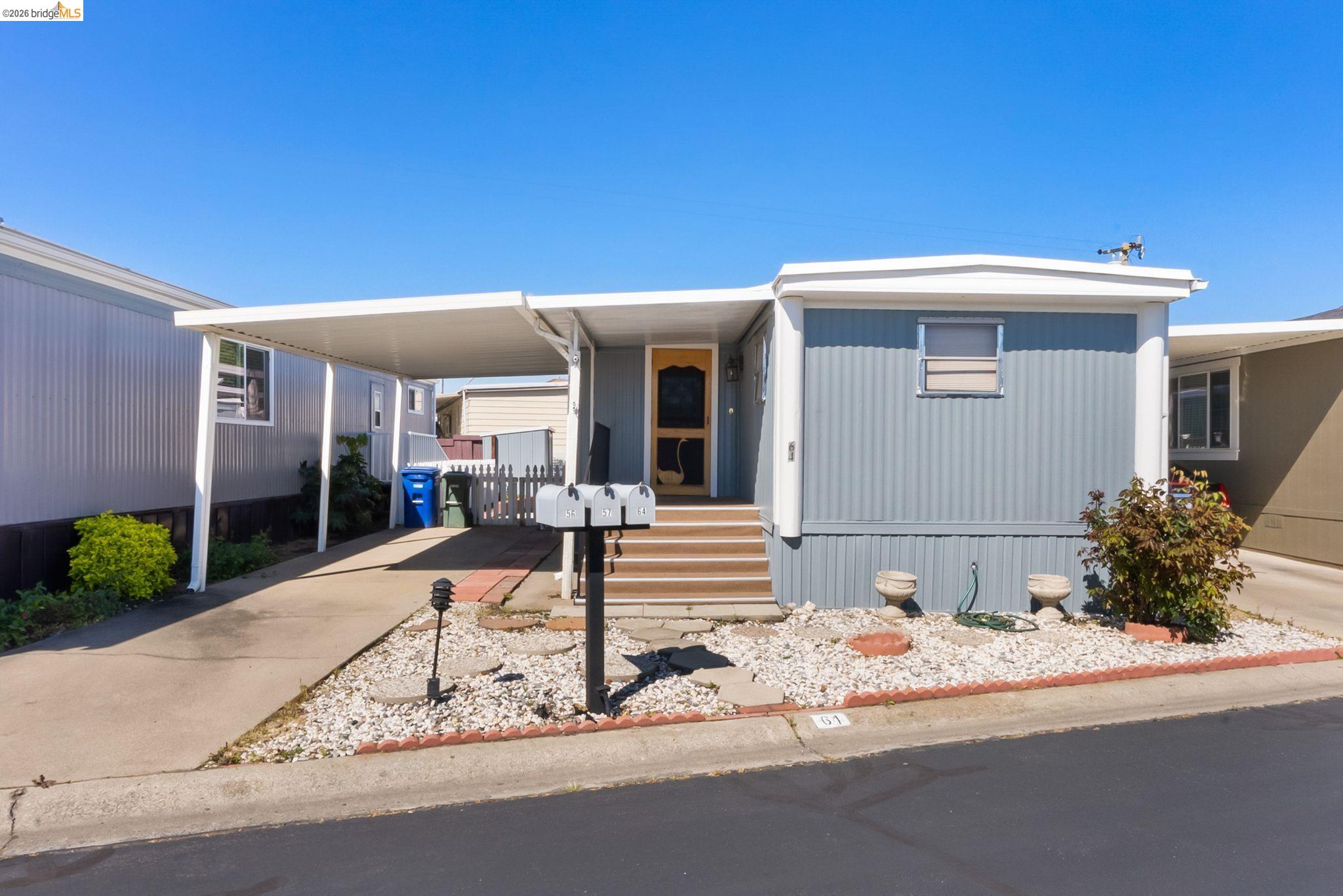 64 Oneida Street Oakley, CA 94561 - Photo 6 of 18 a front view of a house with a yard