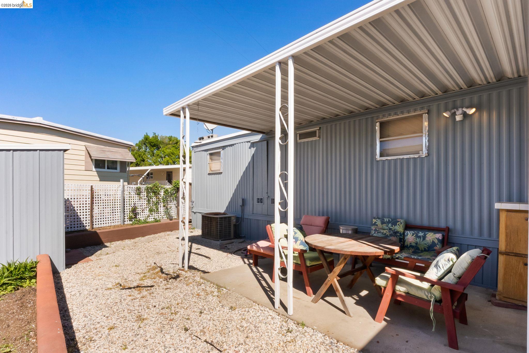 64 Oneida Street Oakley, CA 94561 - Photo 7 of 18 a backyard of a house with table and chairs